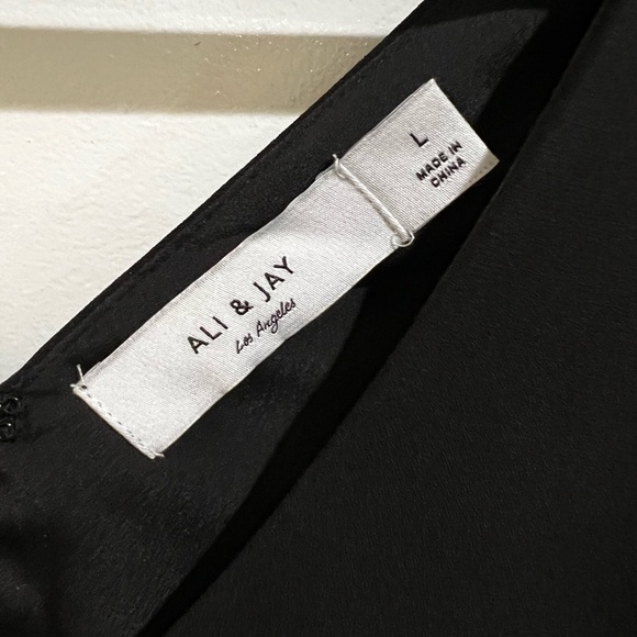 ALI & JAY Elegant Black Dress with White Accents - Picture 5 of 10